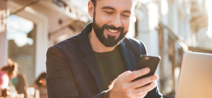 Using digital services on a phone and laptop